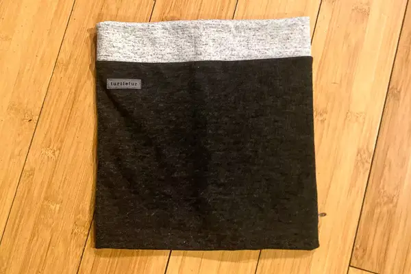 A folded up Turtle Fur Double-layer Neck Warmer