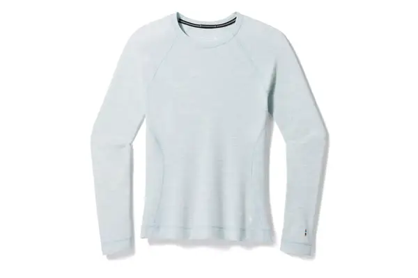 Person wearing ski jacket holding skis