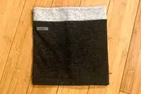 A folded up Turtle Fur Double-layer Neck Warmer