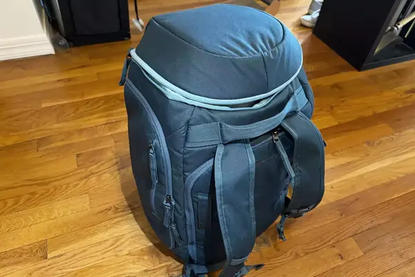 Thule RoundTrip Snowboard and Ski Boot Backpack 60L on wood floor