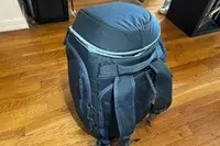 Thule RoundTrip Snowboard and Ski Boot Backpack 60L on wood floor