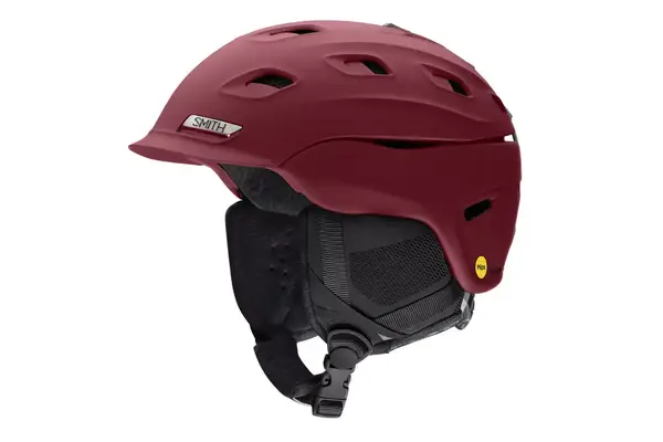 A person wearing the Aspen Collection Cirque Down Jacket outside while skiing