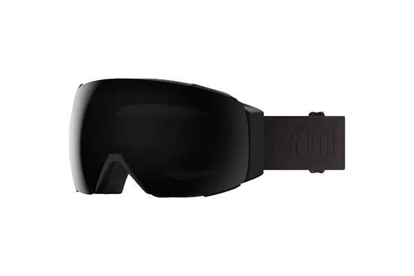 A person wearing the Aspen Collection Cirque Down Jacket outside while skiing