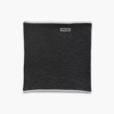 Close up of a person zipping a sleeve pocket on the Aspen Collection Cirque Down Jacket outside