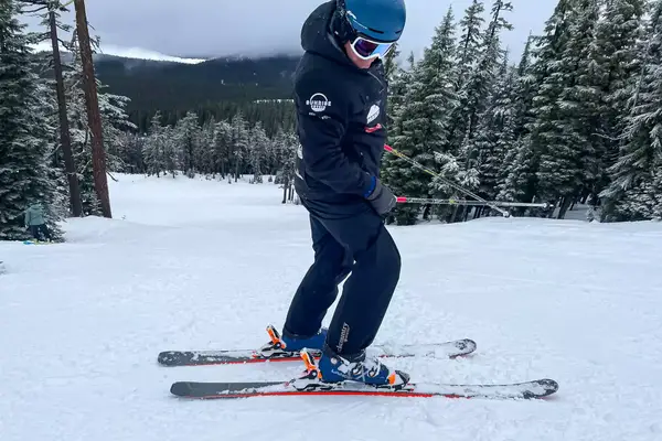 A person wears the Backcountry CrestCarver Men