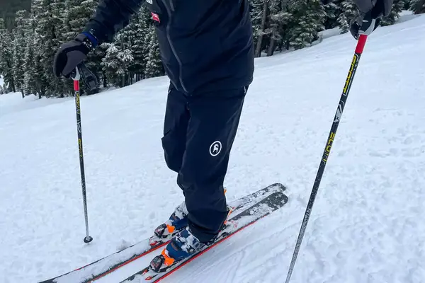 A person skis while wearing the Backcountry CrestCarver Men