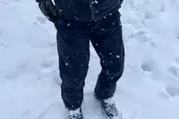 A person wears the Backcountry CrestCarver Men