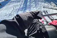 A person wears the Hestra Army Leather Heli Ski Gloves while skiing