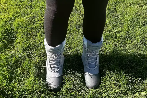 A person wears The North Face Shellista IV Mid WP Boot on grass