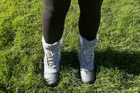 A person wears The North Face Shellista IV Mid WP Boot on grass