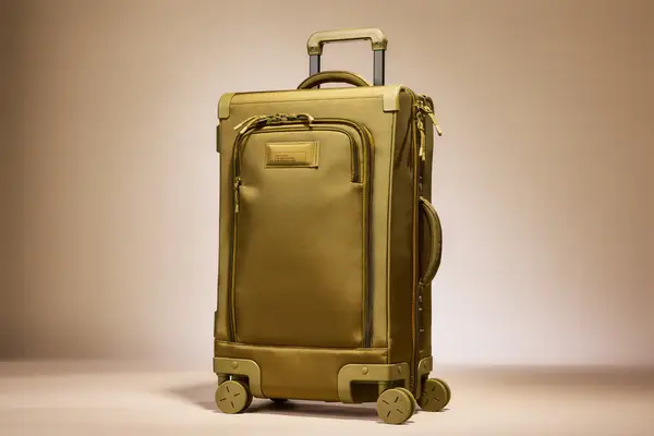 A suitcase with wheels and an extended handle