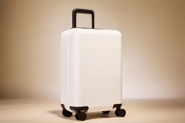 A clean modern luggage on wheels with an extendable handle