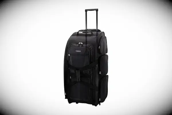 A person adjusts the Away The Outdoor Rolling Duffel 85L