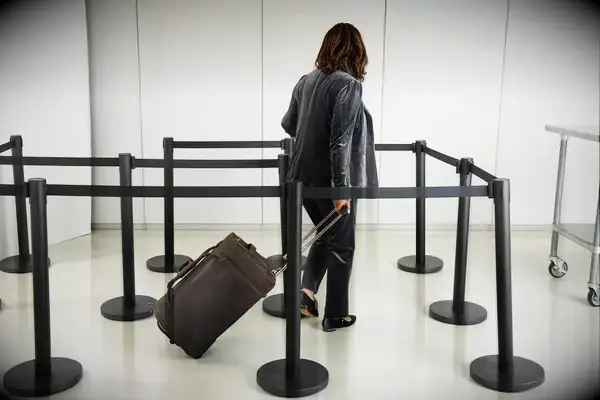 Person lifting the Eagle Creek Cargo Hauler 130L onto a counter