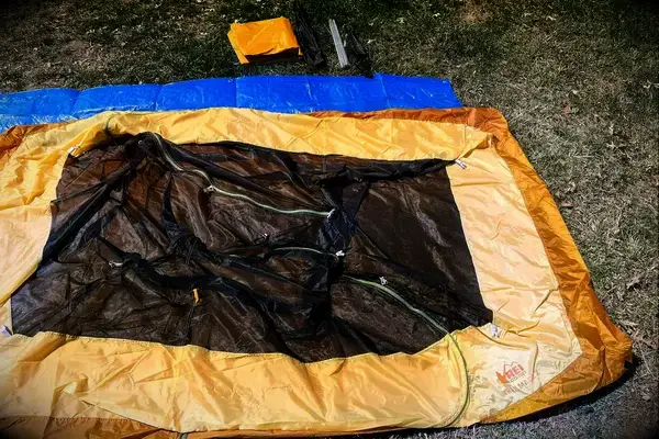 A REI Co-Op Trailmade lying unassembled on the ground