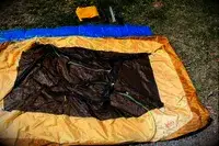 A REI Co-Op Trailmade lying unassembled on the ground