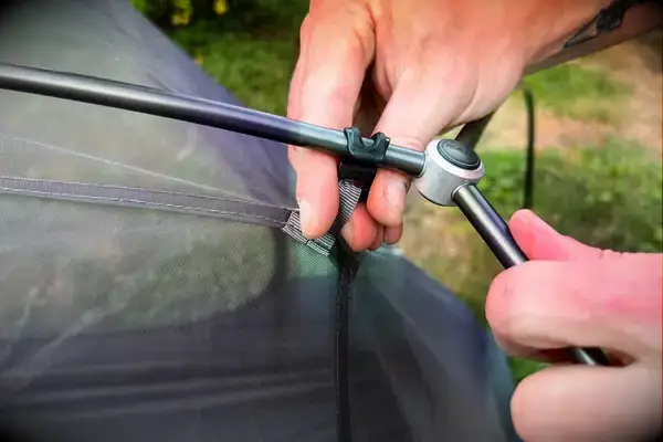 A person attaches the Sea to Summit Telos Freestanding Ultralight Tent to the base