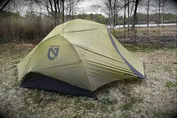 A NEMO Dagger OSMO Lightweight Backpacking Tent in a clearing