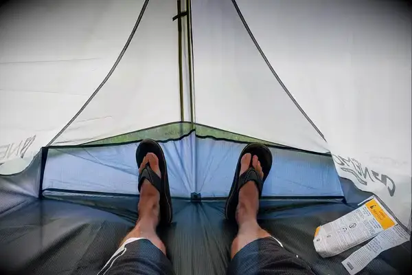 A person lays inside the Nemo Hornet Osmo Ultralight Backpacking Tent