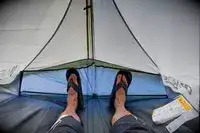 A person lays inside the Nemo Hornet Osmo Ultralight Backpacking Tent