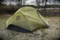 A NEMO Dagger OSMO Lightweight Backpacking Tent in a clearing
