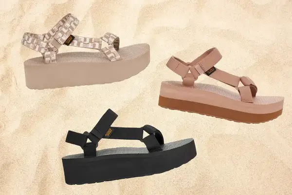 Teva Flatform Universal Sandals in Black, maple sugar/ lion and glisten simply taupe on a sandy background