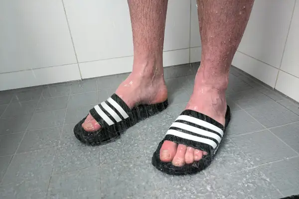 A person wears the Adidas Men