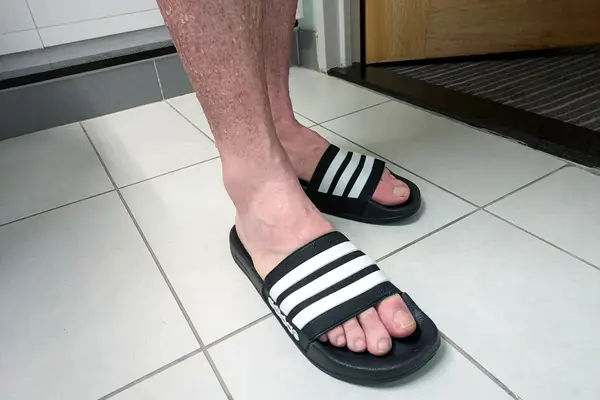 A person wears the Adidas Men