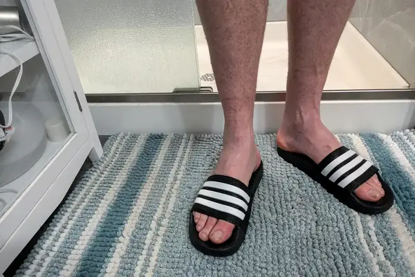 A person wears the Adidas Men