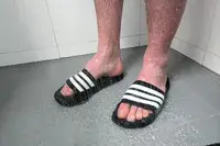 A person wears the Adidas Men