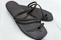 A pair of Crocs Miami Toe Loop Sandals on tile