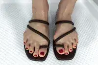 An overhead view of a person wearing the Crocs Miami Toe Loop Sandals