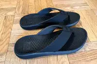 A pair of Reef The Deckhand on a wooden floor