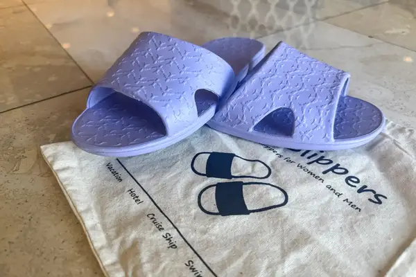 The Anmerl Travel Slippers on top of a storage bag