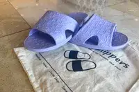 The Anmerl Travel Slippers on top of a storage bag