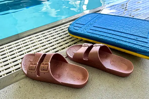 A pair of Freedom Moses Freedom Slides next to a pool