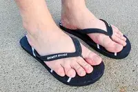 A person wears the Shower Shoez Women