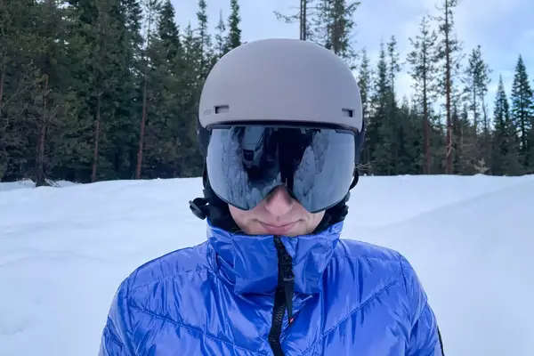 A person wearing the Anon M4S Cylindrical Snow Goggles while skiing