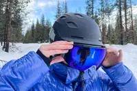 A person wearing the Smith I/O Mag Goggles while skiing
