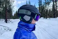 A person wearing the Smith I/O Mag Goggles while skiing