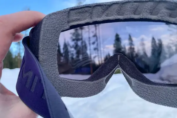 A person holding the Smith Squad Goggles