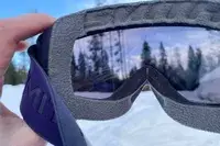 A person holding the Smith Squad Goggles