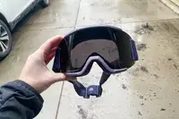 A person holding the Smith Squad Goggles