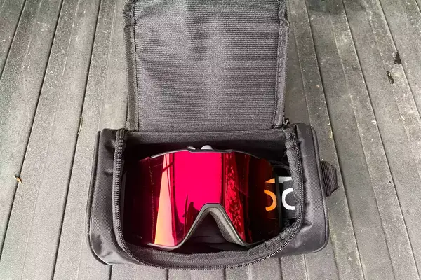 Oakley Line Miner Pro L Snow Goggles in the carry bag on a wooden surface