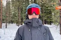 A person wearing the Oakley Line Miner Pro L Snow Goggles while skiing