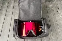 Oakley Line Miner Pro L Snow Goggles in the carry bag on a wooden surface