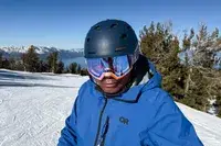 A person wearing the 100 Percent Snowcraft Hiper Goggles while skiing