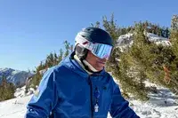 A person wearing the 100 Percent Snowcraft Hiper Goggles while skiing