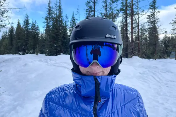 A person wearing the Smith Squad Ski Goggles