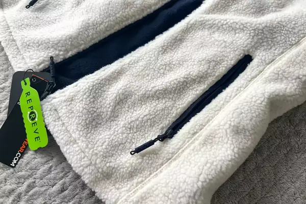 The zippered pocket on the Ororo Women’s Heated Recycled Fleece Vest